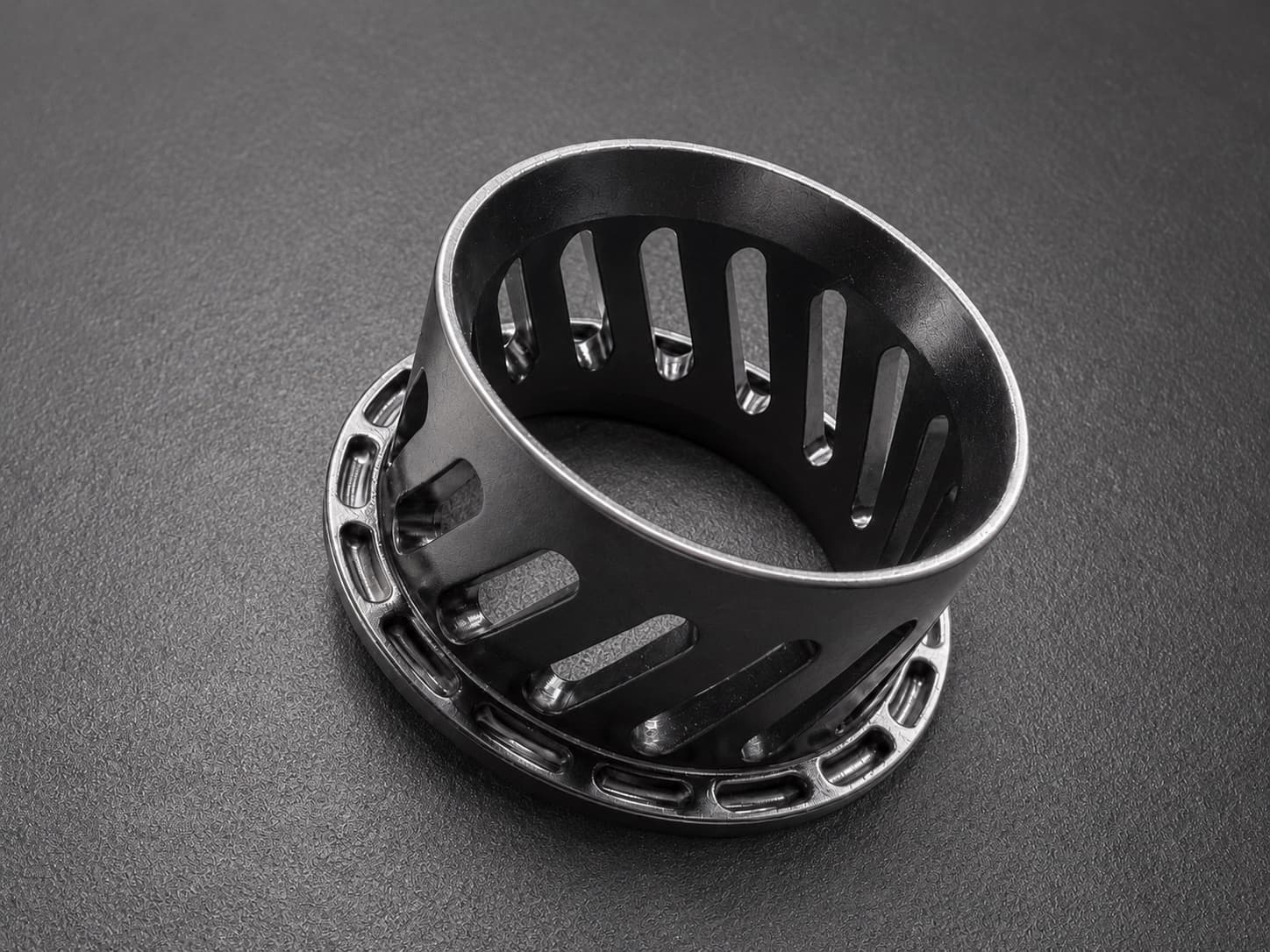 A vapor smoothed custom grommet in Nylon 12 Tough, slotted ring and flange printed as one piece