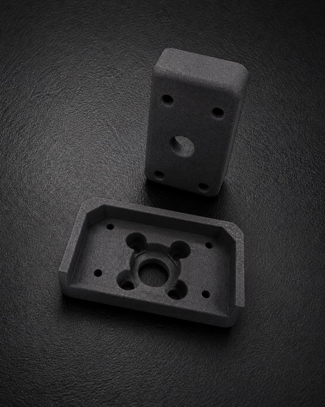 A custom SLS-printed TPU 90A guide and protector for manufacturing equipment, shown top and underside